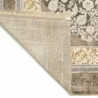 A close-up of a Qaleen Carpets rug's corner, showcasing its intricate design and rich colors