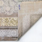 A close-up of a Qaleen Carpets rug, showcasing its intricate patterns and high-quality materials