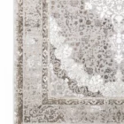 A close-up of a Qaleen Carpets rug with a floral pattern and intricate design, showcasing its beauty and craftsmanship