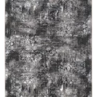A qaleen carpet with a black and white pattern, featuring a distressed design with a mix of dark and light colors, and a