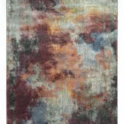 A vibrant, abstract rug with a mix of red, blue, and yellow hues, created by Qaleen Carpets