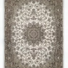 A stunning Qaleen Carpets rug with intricate, hand-knotted patterns and a soft, cream-colored background, perfect for adding