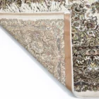 A close-up of a Qaleen Carpets rug's corner, showcasing its intricate design and rich colors