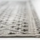 A close-up of a Qaleen Carpets rug's edge, showcasing its intricate design and soft, plush texture
