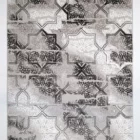 A stunning Qaleen Carpets rug with a unique blend of traditional and modern patterns, featuring a mix of intricate designs