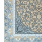 A close-up of a Qaleen Carpets rug with a floral pattern and fringe, set against a white background