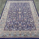 Carpets A beautiful, intricately designed carpet with a rich, vibrant pattern, perfect for adding a touch of elegance to any