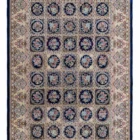A beautiful, intricately designed carpet with a mix of traditional and modern elements, featuring a rich, vibrant color