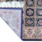 A beautiful, intricately designed carpet with a rich, vibrant pattern, showcasing the art of carpeting and the beauty of
