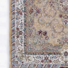 Carpets A beautiful, intricately designed carpet with a rich, vibrant pattern, perfect for adding a touch of elegance to any