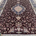 Carpets A beautiful, intricately designed carpet with a rich, dark background and a central, ornate pattern surrounded by a