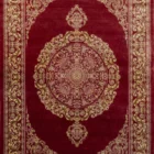 Carpets A beautiful, intricately designed carpet with a rich, red and gold color scheme, featuring a central medallion and