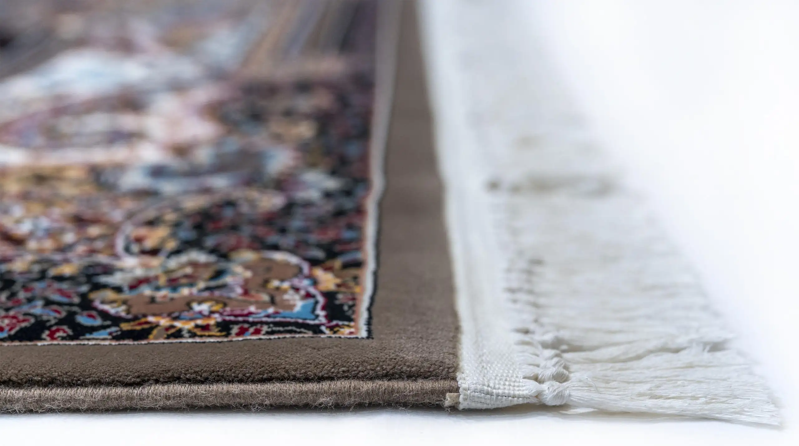 Carpets A close-up of a carpet's edge, with a focus on the intricate patterns and colors