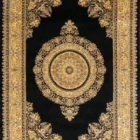 A beautiful, intricately designed carpet with a central medallion and intricate patterns on a dark background, showcasing