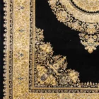 A beautiful, intricately designed carpet with a rich, dark background and a stunning, golden, intricate pattern, perfect for