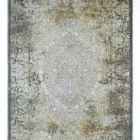 A Qaleen Carpets rug with a traditional, intricate design and a mix of earthy, muted colors