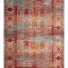 A Qaleen Carpets rug with a red and white patterned design, featuring intricate patterns and a border
