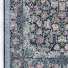 Carpets A beautiful, intricately designed carpet with a floral pattern on a dark background, featuring a mix of colors and a