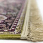 Carpets A close-up of a rug's edge, with a focus on the intricate carpeting and the carpet's edge
