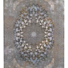 Carpets A rug with a floral pattern in a muted color palette, featuring a central design and border