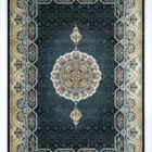 A Qaleen Carpets rug with a dark blue background, intricate patterns, and a central medallion, surrounded by a border of