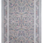 A Qaleen Carpets rug with a light grey and white patterned design, featuring a central floral pattern surrounded by a border