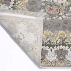 A beautifully designed carpet with a floral pattern, showcasing the art of carpets and rugs