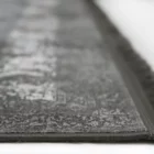 Carpets A close-up of a carpet's edge, with a focus on the intricate pattern and the soft, fluffy texture of the carpet's