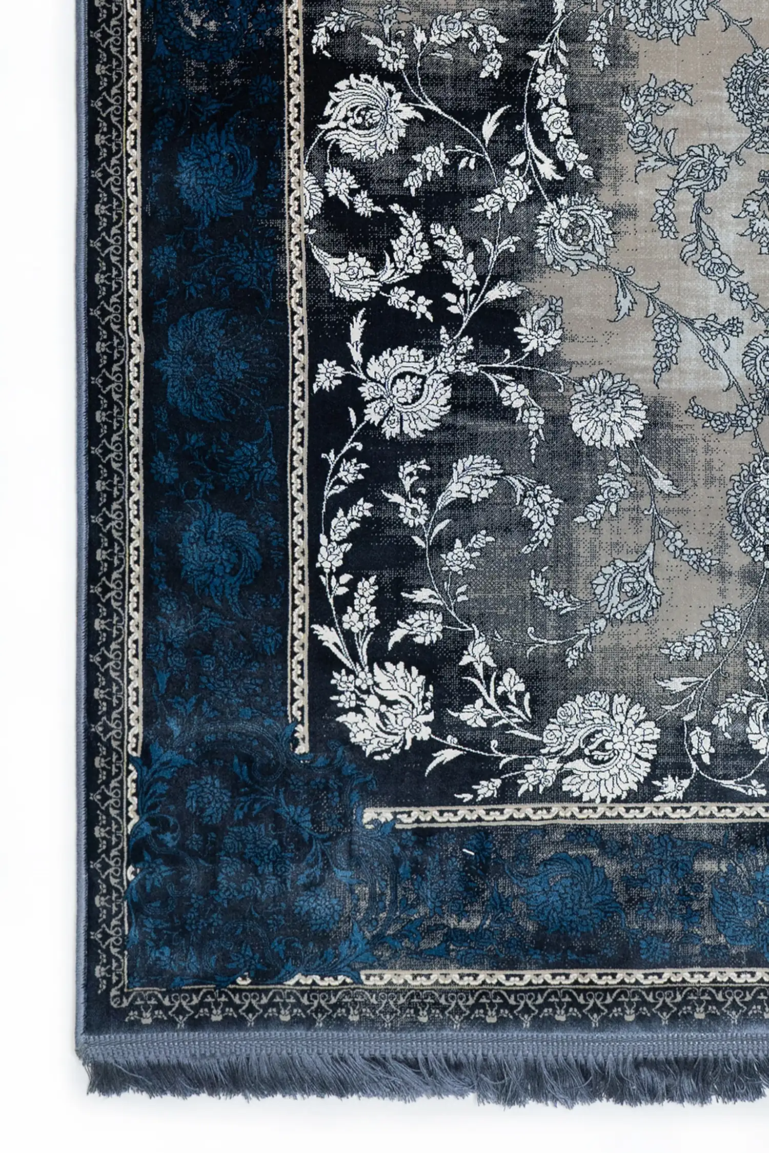 Carpets A close-up of a carpet's edge, with a blue and white floral pattern