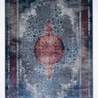 Carpets A rug with a faded, distressed look, with a central red and blue pattern surrounded by a white border