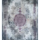 Carpets A rug with a distressed, vintage look, featuring a central floral pattern in a deep, rich color, surrounded by a