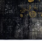 Carpets A dark, distressed carpet with a subtle gold pattern