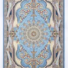 Carpets A beautiful, intricately designed carpet with a blue and gold pattern, featuring a central flower and surrounding