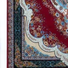 Carpets A beautiful, intricately designed carpet with a rich, red background and intricate patterns, showcasing the art of