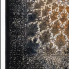 Carpets A rug with a floral pattern in a mix of gold and dark blue colors