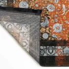 A beautifully crafted carpet with intricate patterns and a rich, vibrant color, perfect for adding a touch of elegance to
