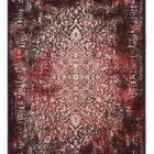 Carpets A rug with a red and white patterned design, with a black border and fringe at the top and bottom
