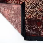 A beautifully designed carpet with a rich, intricate pattern, perfect for adding a touch of elegance to any room, with a