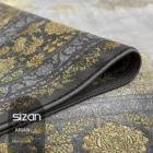 Carpets A close-up of a rolled-up carpet with a gold and grey pattern, with the brand name 'Sizan' in the corner