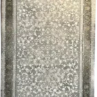 A close-up of a rug with a floral pattern, made by Qaleen Carpets