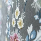 Carpets A close-up of a carpet with a floral pattern, featuring a mix of pink, white, and yellow flowers on a gray background
