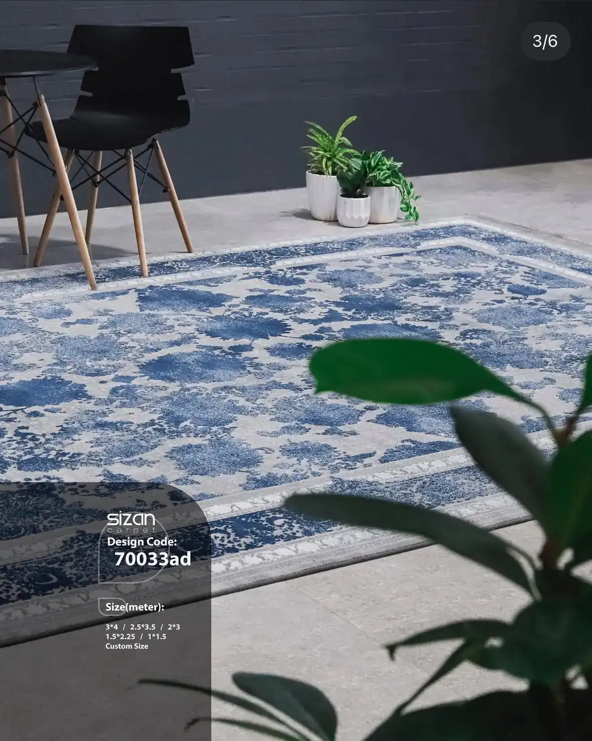 Carpets for Your Home Carpets A beautiful, blue and white, patterned carpet on a grey floor, with a chair and a plant in the background