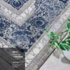 Carpets A beautiful, intricately designed carpet with a mix of blue and white patterns, adding a touch of elegance to any