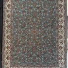 A Qaleen Carpets rug with a gray background, white border, and intricate red and white patterns