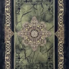 A Qaleen Carpets rug with a green and gold design, featuring a central medallion surrounded by intricate patterns and a