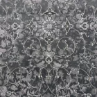 Carpets A close-up of a dark, ornate, and intricate carpet with a pattern of flowers and leaves, with a focus on the