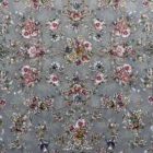 Carpets A beautiful, intricate pattern of flowers and leaves on a gray background, typical of a high-quality carpet or rug