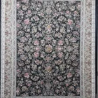 Carpets A large, dark green carpet with a floral pattern